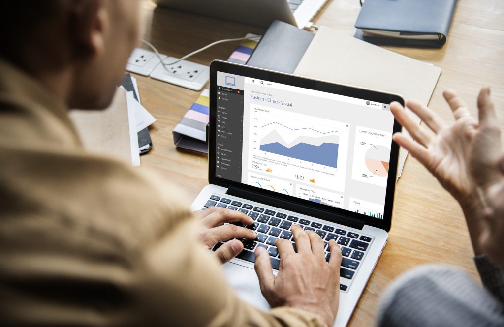 People Working On A Laptop In A Meeting