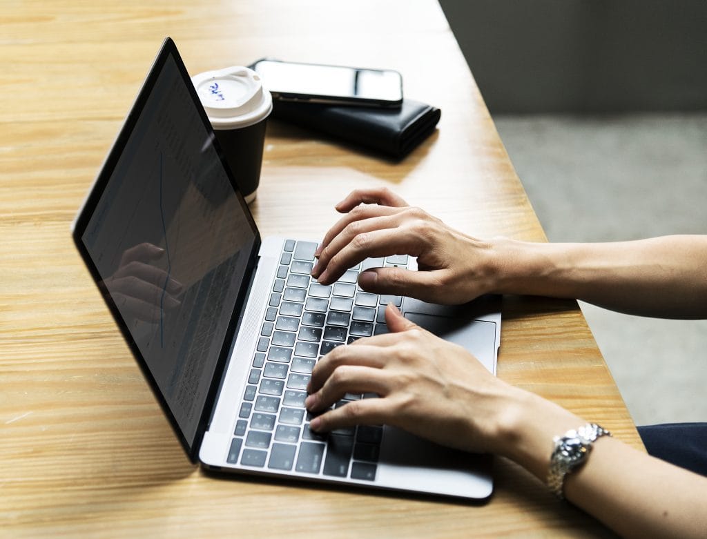 Woman Using A Laptop At Work