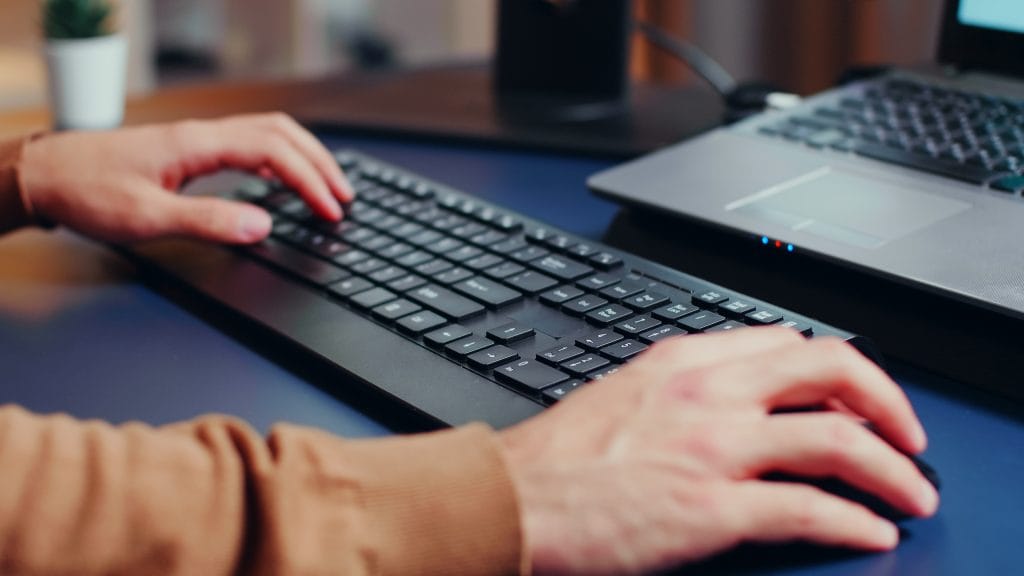 Close Up Of Engineer Hands Typing On Keyboard